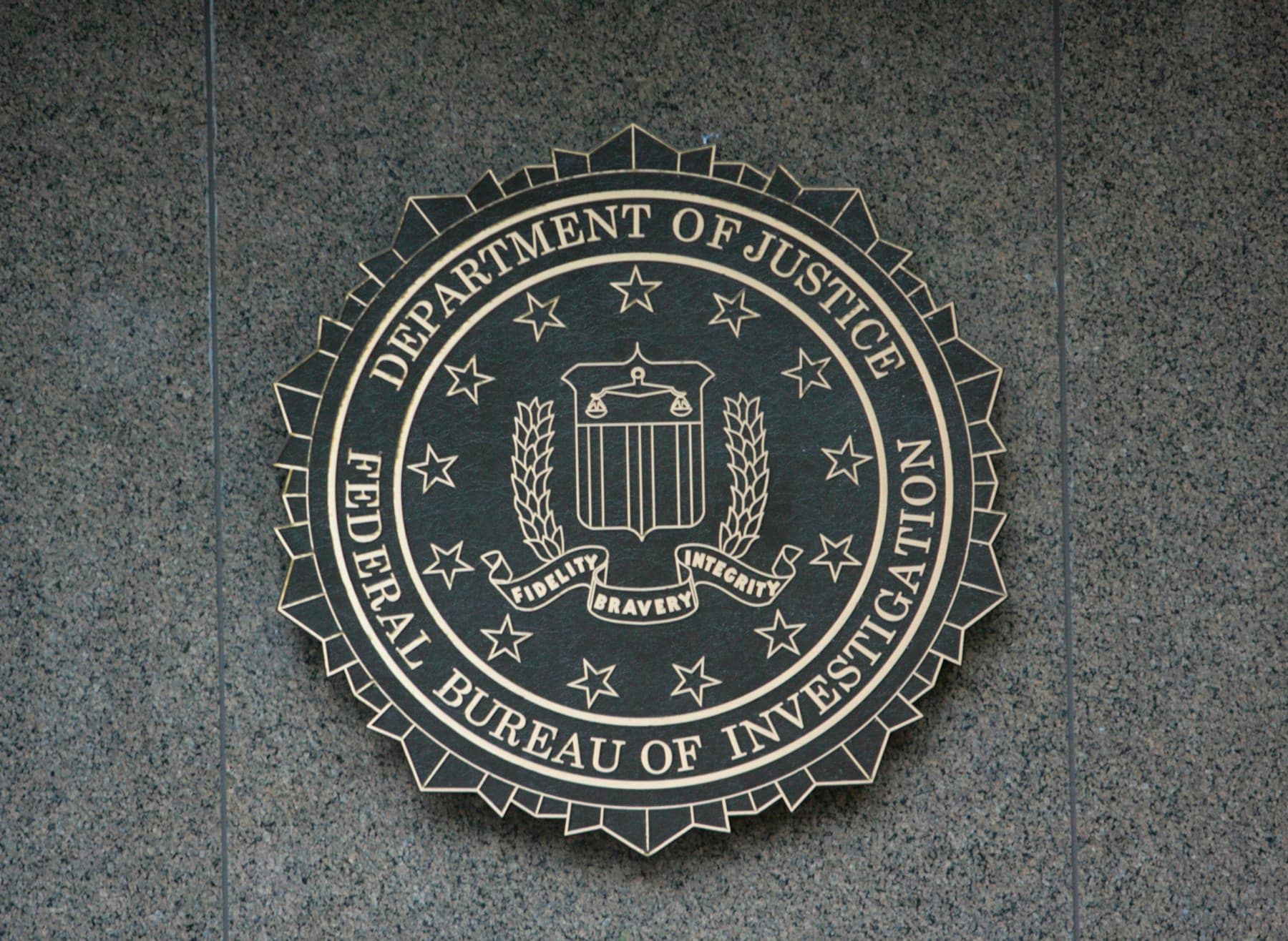 the seal of the department of justice on a wall
